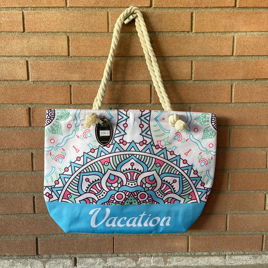 borsa mare con scritta vacation con fantasia di colore azzurra